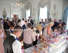Lavish wedding 12' long sweets buffet table